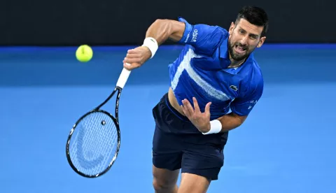 epa11803614 Novak Djokovic of Serbia in action during his quarter-finals match against Reilly Opelka of USA at the Brisbane International tennis tournament in Brisbane, Australia, 03 January 2025. EPA/DARREN ENGLAND AUSTRALIA AND NEW ZEALAND OUT