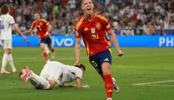 epa11468980 Daniel Olmo of Spain celebrates after scoring the 2-1 goal during UEFA EURO 2024 semi-finals soccer match between Spain and France in Munich, Germany, 09 July 2024. EPA/CLEMENS BILAN