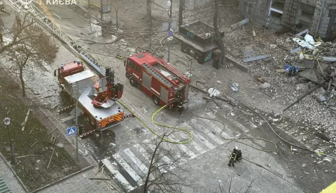 epa11801357 A handout photo made available by the State Emergency Service shows Ukrainian rescuers working at the site of a drone attack on a residential building in Kyiv, Ukraine, 01 January 2025. According to the State Emergency Service, the Russian drone attack in Kyiv killed at least two people and injured six more. Russian troops entered Ukraine on 24 February 2022, starting a conflict that has provoked destruction and a humanitarian crisis. EPA/STATE EMERGENCY SERVICE HANDOUT HANDOUT EDITORIAL USE ONLY/NO SALES