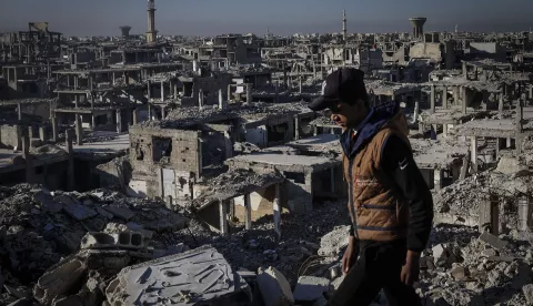 epa11790831 A child walks on top of a building in the Yarmouk refugee camp on the outskirts of Damascus, Syria, 19 December 2024 (issued 23 December 2024). Established in 1957, some 160,000 Palestinians lived in Yarmouk according to UNRWA until the start of the Syrian uprising in 2011. Fierce fighting led to the displacement of a large number of inhabitants in 2012 and access to humanitarian aid was severly limited following its besiegement by the then Syrian government of Bashar al-Assad in 2013. EPA/ANTÓNIO PEDRO SANTOS