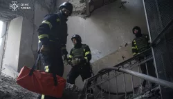 epa11801356 A handout photo made available by the State Emergency Service shows Ukrainian rescuers working at the site of a drone attack on a residential building in Kyiv, Ukraine, 01 January 2025. According to the State Emergency Service, the Russian drone attack in Kyiv killed at least two people and injured six more. Russian troops entered Ukraine on 24 February 2022, starting a conflict that has provoked destruction and a humanitarian crisis. EPA/STATE EMERGENCY SERVICE HANDOUT HANDOUT EDITORIAL USE ONLY/NO SALES