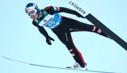 epa11799942 Daniel Tschofenig of Austria soars through the air during the qualification for the second stage of the 73rd Four Hills ski jumping tournament, in Garmisch-Partenkirchen, Germany, 31 December 2024. EPA/ANNA SZILAGYI