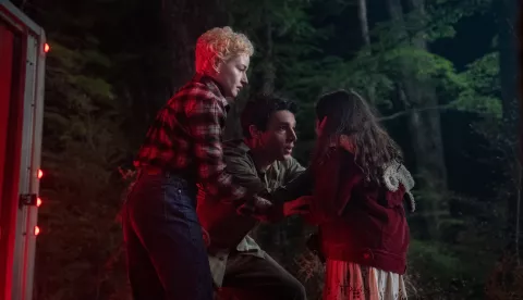 (from left) Charlotte (Julia Garner), Blake (Christopher Abbott) and Ginger (Matilda Firth) in Wolf Man, directed by Leigh Whannell.