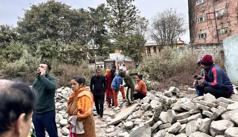 epa11810843 Nepalese people gather after getting out of their homes following an early morning earthquake in Kathmandu, Nepal, 07 January 2025. A 6.8-magnitude earthquake that hit western China's mountainous Tibet autonomous region, killing at least 95 people and injuring 130 others on the morning of 07 January, was also felt in neighbouring Nepal and parts of India, according to Chinese state media. EPA/SUNIL SHARMA