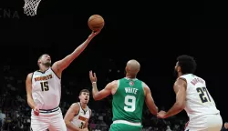 epa11646022 Nikola Jokic (L) of Denver Nuggets in action during the NBA Abu Dhabi Games 2024 between Boston Celtics and Denver Nuggets in Abu Dhabi, United Arab Emirates, 06 October 2024. EPA/ALI HAIDER SHUTTERSTOCK OUT