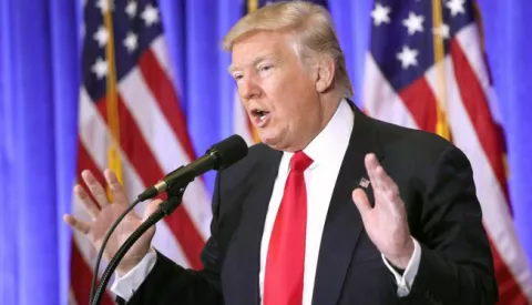 epa05711249 US President-elect Donald Trump speaks during a press conference in the lobby of Trump Tower in New York, New York, USA, 11 January 2017. Trump, who is set to take the Oath of Office on 20 January 2017, gave his first press conference in nearly 6 months. EPA/JUSTIN LANE