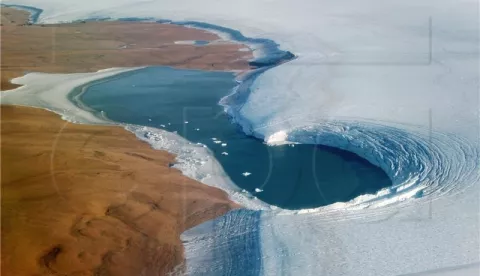 epa07875699 A handout photo made available by NASA shows an aerial view of a lake bounded to the left by Washington Land, a deglaciated peninsula that juts into the Kane Basin, and at right by the Humboldt Glacier, Greenland's widest marine-terminating glacier, 04 September 2019 (issued 28 September 2019). The image was taken by John Sonntag, a scientist at NASA's Goddard Space Flight Center, during an airborne campaign for NASA's Operation IceBridge. The flight was one of 11 flown in September 2019 on NASA's Gulfstream-V to measure summer melting on Greenland. The measurements will be compared to those collected during the IceBridge campaign in spring 2019, and with measurements from the new Ice, Cloud and land Elevation Satellite-2 (ICESat-2), which launched one year ago. EPA/JOHN SONNTAG/OPERATION ICEBRIDGE/NASA HANDOUT HANDOUT EDITORIAL USE ONLY/NO SALES