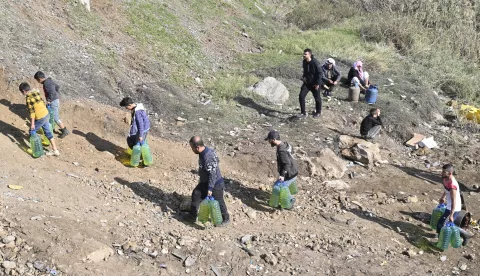 epa11767962 People, including Syrian and Lebanese displaced persons, cross the destroyed Arida border between the two countries, in Akkar, Lebanon, 10 December 2024. The Arida border crossing in Akkar was most recently damaged in an airstrike carried out by Israel on 06 December, according to Lebanon's National News Agency (NNA). Several Lebanese displaced people who fled to Syria during the conflict between Hezbollah and Israel are attempting to return through the border crossing, as well as displaced Syrians in Lebanon who are crossing back to their homeland. Syrian rebels entered Damascus on 08 December 2024 and announced in a televised statement the 'Liberation of the city of Damascus and the overthrow of Bashar al-Assad', as well as the release of all the prisoners. EPA/WAEL HAMZEH