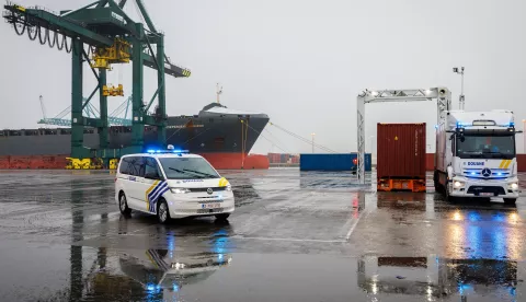 epa11814332 Belgian customs at the Border Inspection Post on Left Bank operate a mobile scanner to inspect a container during a press conference by the General Administration of Customs and Excise on the 2024 figures for drug seizures in the port of Antwerp, in Antwerp, Belgium, 09 January 2025. EPA/OLIVIER MATTHYS