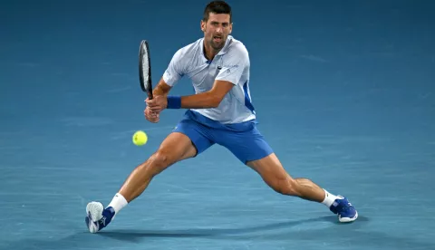 epa11093264 Novak Djokovic of Serbia returns during his 4th round match against Adrian Mannarino of France on Day 8 of the 2024 Australian Open at Melbourne Park in Melbourne, Australia, 21 January 2024. EPA/LUKAS COCH AUSTRALIA AND NEW ZEALAND OUT