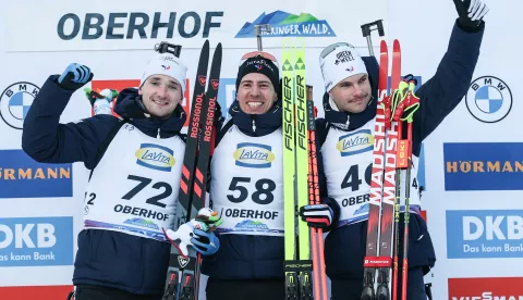 epa11817057 (L-R) Second placed France's Fabien Claude, winner France's Quentin Fillon Maillet, and third placed France's Emilien Jacquelin celebrate on the podium after the Men's 10km sprint race at the IBU Biathlon World Cup in Oberhof, Germany, 10 January 2025. EPA/FILIP SINGER