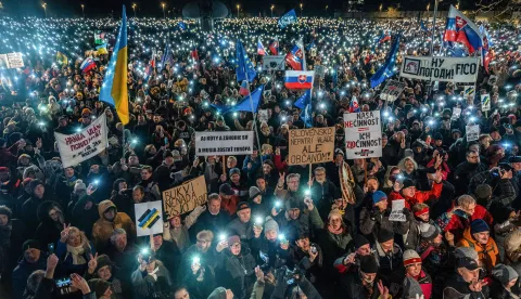 epaselect epa11817188 People carrying flags and placards hold up their mobile phones' torches during a demonstration against the Slovak prime minister, in front of the Government Office building, in Bratislava, Slovakia, 10 January 2025. The protests, titled 'Slovakia is Europe- Enough of Russia!', were sparked by Prime Minister Robert Fico's meeting with Russian President Vladimir Putin in Moscow in December 2024. EPA/JAKUB GAVLAK