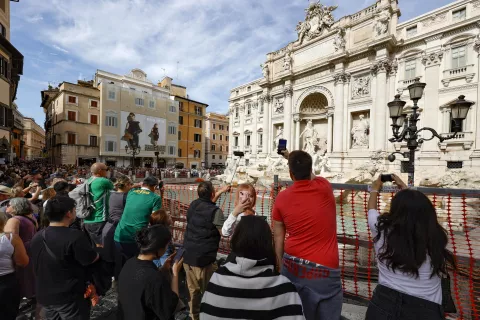 epa11650519 Tourists visit the Fontana di Trevi (Trevi Fountain), as it is cordoned due to the start of maintenance work, in Rome, Italy, 09 October 2024. According to the mayor of Rome, maintenance works, supervised by the Capitoline Superintendency, are expected to last until the end of the year. He also added that Trevi Fountain access would be limited during the Roman Catholic Jubilee Holy Year of 2025 as part of a pilot scheme that may introduce a fee. EPA/FABIO FRUSTACI