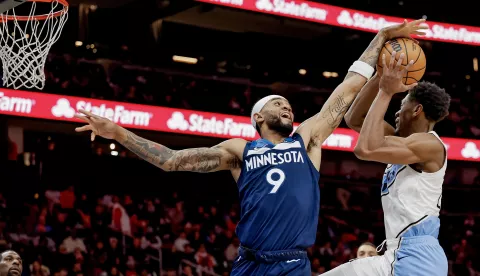 epa11791559 Atlanta Hawks forward De'Andre Hunter (R) in action against Minnesota Timberwolves guard Nickeil Alexander-Walker (L) of Canada during the second half of an NBA basketball game between the Minnesota Timberwolves and the Atlanta Hawks in Atlanta, Georgia, USA, 23 December 2024.= EPA/ERIK S. LESSER SHUTTERSTOCK OUT