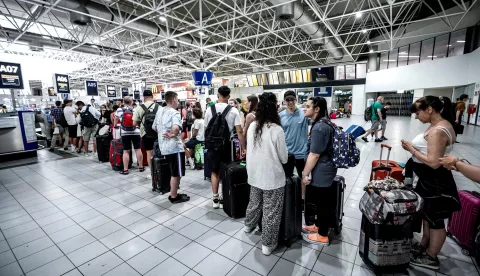 epa11487976 Passengers queuing at Caselle airport, in Turin, Italy, 19 July 2024. Due to the global IT outage, Turin-Caselle Airport advised passengers to arrive early for their flights. Companies and institutions around the world have been affected on 19 July by a major computer outage in systems running Microsoft Windows linked to a faulty CrowdStrike cyber-security software update. According to CrowdStrike's CEO, the issue has been identified, isolated and a fix has been deployed. EPA/TINO ROMANO