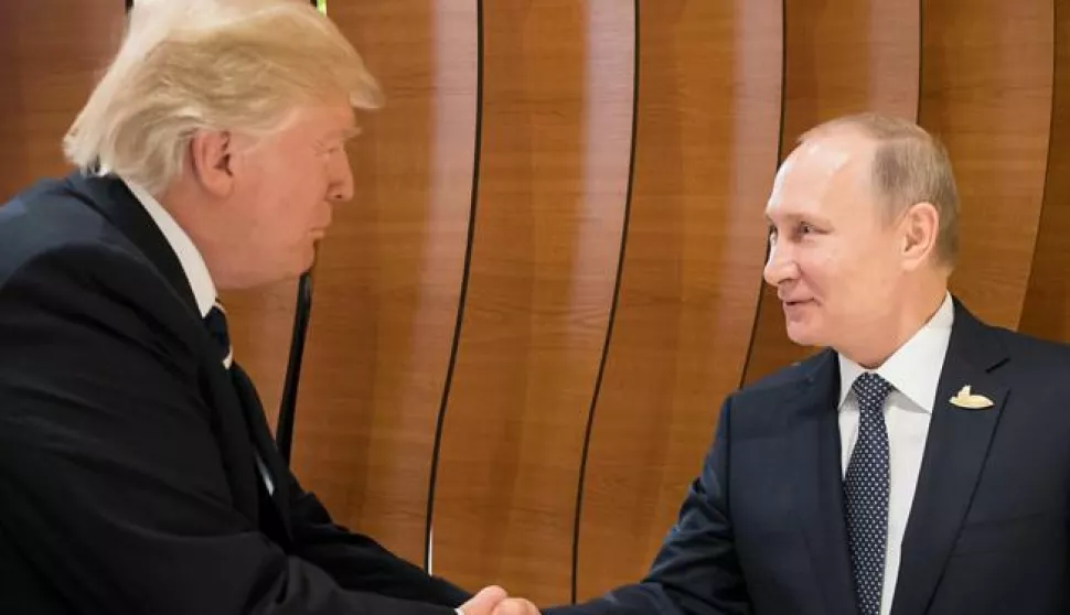 epa06072749 A handout photo made available by the German Government on 07 July 2017 of US President Donald J. Trump (L) shaking hands with Russian President Vladimir Putin during the retreat at the opening day of the G20 summit in Hamburg, Germany, 07 July 2017. The G20 Summit (or G-20 or Group of Twenty) is an international forum for governments from 20 major economies. The summit is taking place in Hamburg 07 to 08 July 2017. EPA/STEFFEN KUGLER HANDOUT HANDOUT EDITORIAL USE ONLY/NO SALES