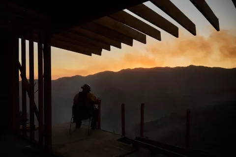 epaselect epa11819253 A firefighter keeps watch over a burned canyon during the Palisades wildfire in Los Angeles, California, USA, 11 January 2025. Thousands of firefighting and emergency personnel are involved in response efforts, as multiple wildfires are continuing to burn across thousands of acres in Southern California, destroying thousands of homes and forcing people to evacuate areas throughout the Los Angeles area. EPA/ALLISON DINNER