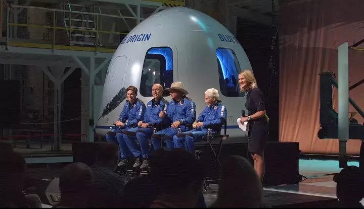 epa09355354 A frame grab from a Blue Origin handout video showing (L-R) Oliver Daemen, Mark Bezos, Jeff Bezos, Wally Funk and Ariane Cornell during a press conference after Blue Origin New Shepard made a trip to space following lift off from Launch Site One, Texas, USA, 20 July 2021. EPA/BLUE ORIGIN/HANDOUT HANDOUT EDITORIAL USE ONLY/NO SALES