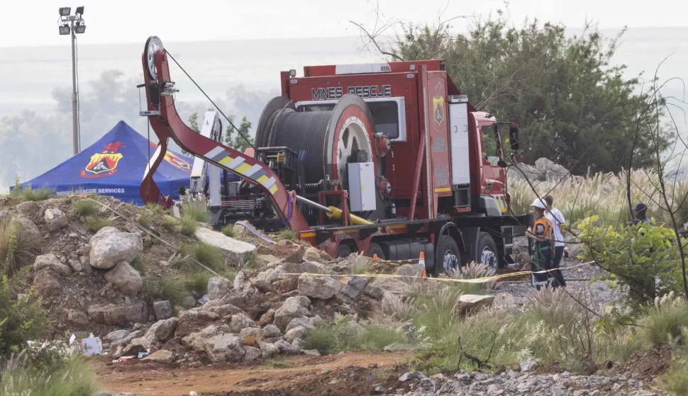 epa11823204 Members of the rescue services use heavy rescue equipment during the official rescue mission of an unknown number of miners near the entrance to a disused gold mine shaft in Stilfontein, around 150 kilometers southwest of Johannesburg, South Africa, 14 January 2025. A South African court has ordered the official rescue attempts to begin as an unknown number of illegal gold miners, or Zama Zama, are trapped underground, of which 10 miners have been rescued. The number of Zama Zama to have died underground has already reached 109 according to an attorney at Lawyers for Human Rights. The miners are armed and form part of a wider syndicate-driven gold mining operation that often uses disused commercial gold mines to search for gold.  EPA/KIM LUDBROOK