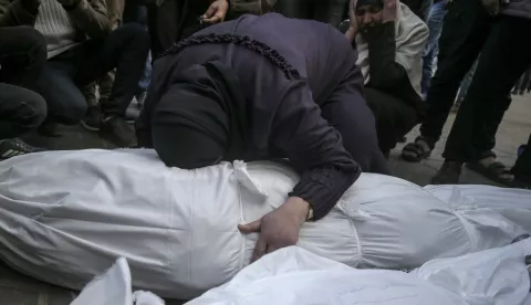 epa11825824 Palestinian women mourn over the covered bodies of the members of a Palestinian family killed in an Israeli airstrike, at Al Aqsa Martyrs Hospital in Deir Al Balah town, central Gaza Strip, 15 January 2025. According to the Palestinian Ministry of Health in Gaza, at least 11 Palestinians were killed following an overnight Israeli airstrike in Deir Al Balah, central Gaza. More than 46,500 Palestinians and over 1,400 Israelis have been killed, according to the Palestinian Health Ministry and the Israeli Army, since Hamas militants launched an attack against Israel from the Gaza Strip on 07 October 2023, and the Israeli operations in Gaza and the West Bank which followed it. EPA/MOHAMMED SABER