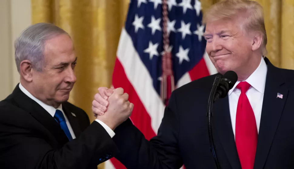 epaselect epa08173197 US President Donald J. Trump (R) shakes hands with Prime Minister of Israel Benjamin Netanyahu while unveiling his Middle East peace plan in the East Room of the White House, in Washington, DC, USA, 28 January 2020. US President Donald J. Trump's Middle East peace plan is expected to be rejected by Palestinian leaders, having withdrawn from engagement with the White House after Trump recognized Jerusalem as the capital of Israel. The proposal was announced while Netanyahu and his political rival, Benny Gantz, both visit Washington, DC. EPA/MICHAEL REYNOLDS