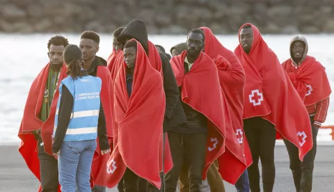 epa11803358 A Frontex officer (2-L) receives several migrants upon their arrival at the port of the town of Arrecife, in Lanzarote island, after a boat with 57 migrants on board was rescued by a Spanish Sea Rescue Unit ship off Lanzarote island's coast, Canary Islands, southwestern Spain, 03 January 2025. EPA/Adriel Perdomo