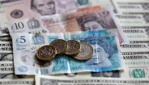 epa11816587 The British pound and US dollar banknotes in London, Britain, 10 January 2025. The British pound has fallen to its lowest level in fourteen months, while UK borrowing costs have hit their highest for 16 years amidst a deepening bond crisis. EPA/ANDY RAIN