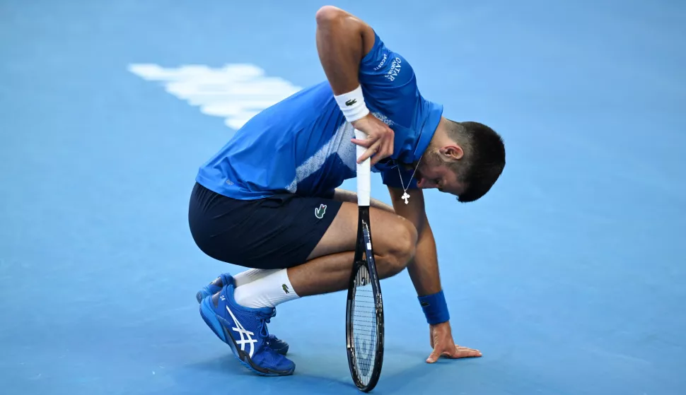 epa11830141 Novak Djokovic of Serbia crouches during the Men's Singles round 3 match against Tomas Machac of Czechia at the Australian Open Grand Slam tennis tournament in Melbourne, Australia, 17 January 2025. EPA/JAMES ROSS AUSTRALIA AND NEW ZEALAND OUT