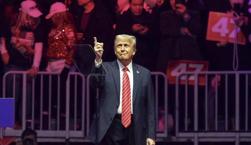 epa11837530 US President-elect Donald Trump arrives to address supporters at a rally at Capital One Arena in Washington, DC, USA, 19 January 2025.. President-elect Donald Trump, who defeated Joe Biden to become the 47th president of the United States, will be inaugurated on 20 January, though all of the planned outdoor ceremonies and events have been cancelled due to a forecast of extreme cold temperatures. EPA/WILL OLIVER