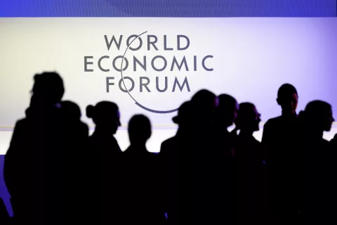 epa11838084 Participants walk under a WEF logo inside the congress center prior to the 55th annual meeting of the World Economic Forum (WEF) in Davos, Switzerland, 20 January 2025. The World Economic Forum annual meeting brings together entrepreneurs, scientists, corporate and political leaders in Davos and takes place from January 20 to 24. EPA/LAURENT GILLIERON