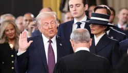 epa11839241 Donald Trump is sworn in as the 47th US President as Barron Trump and Melania Trump look on in the US Capitol Rotunda in Washington, DC, USA, 20 January 2025. EPA/KEVIN LAMARQUE/POOL