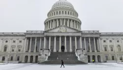 epaselect epa11809505 A person walks past the US Capitol as lawmakers gather to certify President-elect Trump's election victory in Washington, DC, USA, 06 January 2025. The certification comes exactly four years after a mob of Trump-supporting insurrectionists stormed the Capitol, attempting to disrupt the certification of US President Joe Biden. EPA/JIM LO SCALZO