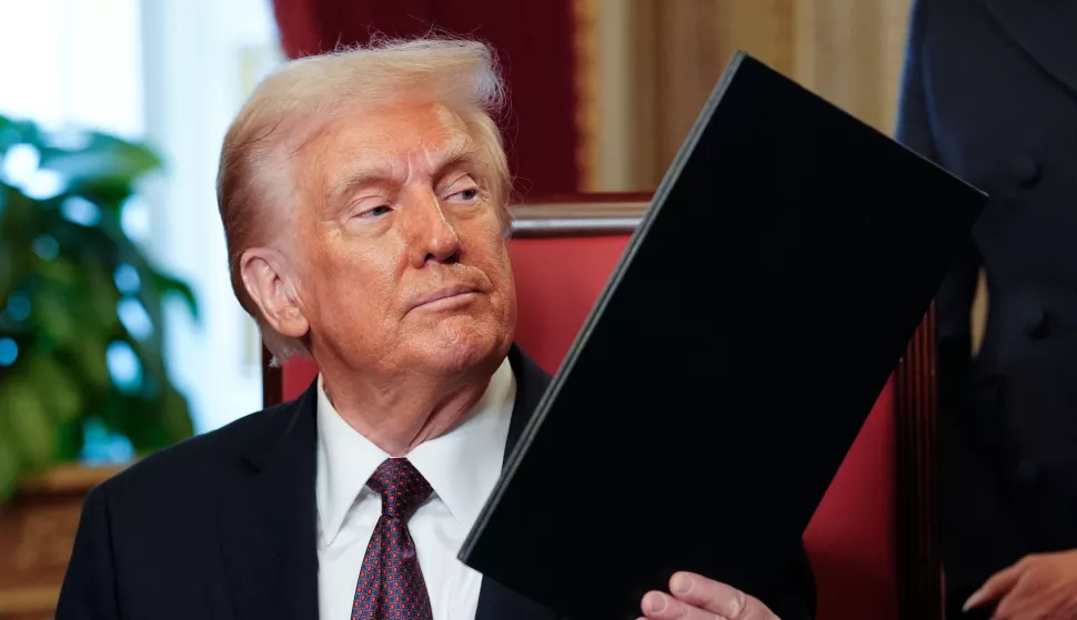 epa11840282 Newly sworn-in President Donald Trump takes part in a signing ceremony in the President's Room following the 60th inaugural ceremony at the US Capitol in Washington, DC, USA, 20 January 2025. Trump became the 47th president of the United States in a rare indoor inauguration ceremony. The parade was also moved inside Capitol One Arena due to weather. EPA/Melina Mara/POOL