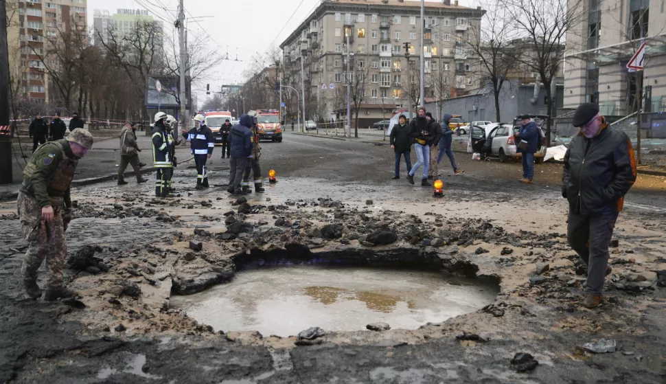 epa11832945 Rescuers and police officers work at the site of a missile strike in Kyiv, Ukraine, 18 January 2025, amid the Russian invasion. At least three people were killed and three others injured as a result of Russian shelling in Kyiv, according to the State Emergency Service of Ukraine (SESU). EPA/SERGEY DOLZHENKO