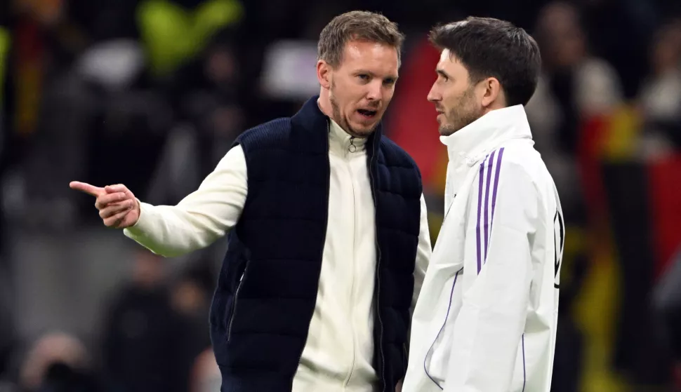 26 March 2024, Hesse, Frankfurt/M.: Soccer: International match, Germany - Netherlands, at Deutsche Bank Park. Germany's national coach Julian Nagelsmann and assistant coach Benjamin Gl?ck after the match. Photo: Federico Gambarini/dpa Photo: Federico Gambarini/DPA