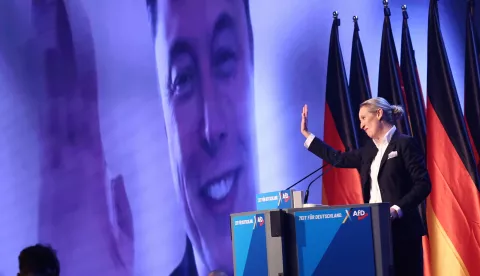 epa11852259 Alternative for Germany (AfD) party and faction co-chairwoman and top candidate for the federal election Alice Weidel talks online to Elon Musk during her speech during election campaign launch in Halle, Germany, 25 January 2025. Germany will hold early federal elections on 23 February 2025. EPA/HANNIBAL HANSCHKE