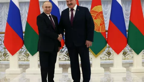 epa10373941 Russian President Vladimir Putin and Belarusian President Alexander Lukashenko shake hands before their meeting at the Palace of Independence in Minsk, Belarus, 19 December 2022. Vladimir Putin holds talks with his Belarusian counterpart and to discuss the issues of security in the region and joint measures to respond to challenges. EPA/KONSTANTIN ZAVRAZHIN/SPUTNIK/KREMLIN POOL MANDATORY CREDIT