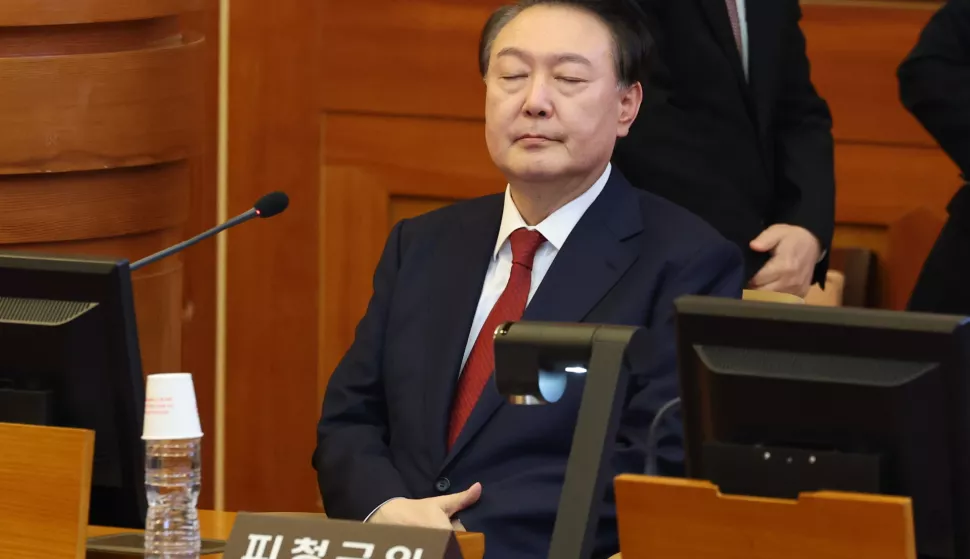 epa11841172 South Korean President Yoon Suk Yeol reacts as he attends the third hearing of his impeachment trial in connection to his short-lived imposition of martial law at the Constitutional Court in Seoul, South Korea, 21 January 2025. EPA/YONHAP/POOL SOUTH KOREA OUT