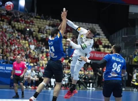 epa11853029 Marko Grgic (C) of Germany in action during the IHF Men's Handball World Championship 2025 main round match between Germany and Tunisia at Jyske Bank Boxen in Herning, Denmark, 25 January 2025. EPA/HENNING BAGGER DENMARK OUT