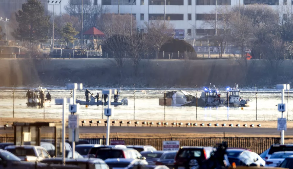 epa11863578 Rescue teams search the wreckage of a commercial airplane that collided with a military helicopter, in Washington, DC, USA, 30 January 2025. DC Fire and EMS Chief John Donnelly said no survivors are expected following the collision of an American Eagle Flight, with 60 passengers and four crew members on board, with a US Army Black Hawk helicopter carrying three US service members late on 29 January, over the Potomac River near Reagan Washington National Airport. EPA/JIM LO SCALZO