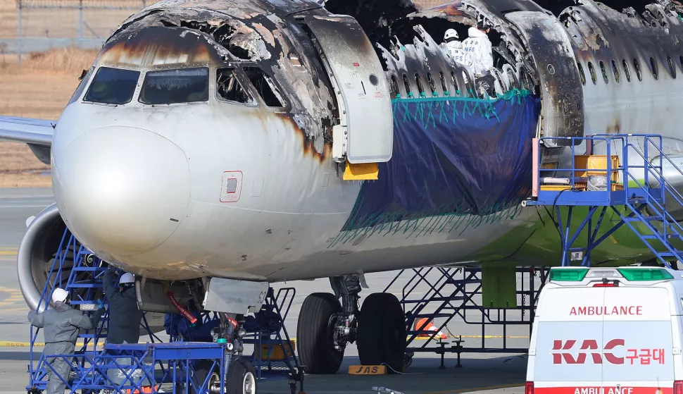 epa11871474 Inspectors examine the burnt Air Busan plane after it caught fire at the airport before takeoff on 31 January 2025 at Gimhae International Airport in the southeastern port city of Busan, South Korea, 03 February 2025. EPA/YONHAP SOUTH KOREA OUT