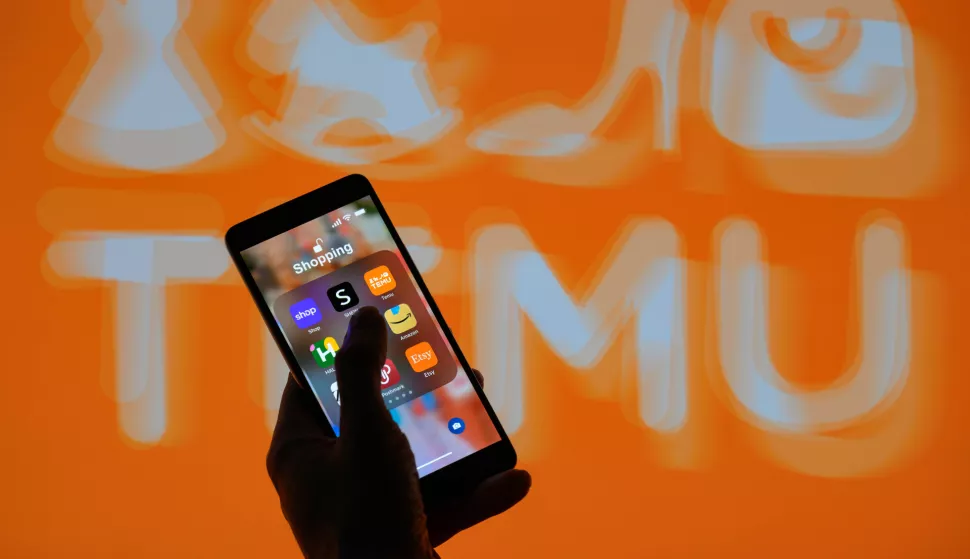 The Temu app icon is displayed on a smartphone with Temu visible in the background in this photo illustration. Taken in Brussels, Belgium. On May 16, 2024. (Jonathan Raa/Sipa USA) *** Strictly for editorial news purposes only *** Photo: Jonathan Raa/SIPA USA