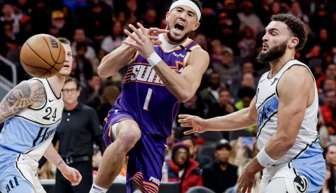 epa11825151 Phoenix Suns guard Devin Booker (L) has the ball stripped by Atlanta Hawks forward David Roddy (R) during the first half of an NBA basketball game between the Phoenix Suns and the Atlanta Hawks in Atlanta, Georgia, USA, 14 January 2025. EPA/ERIK S. LESSER SHUTTERSTOCK OUT