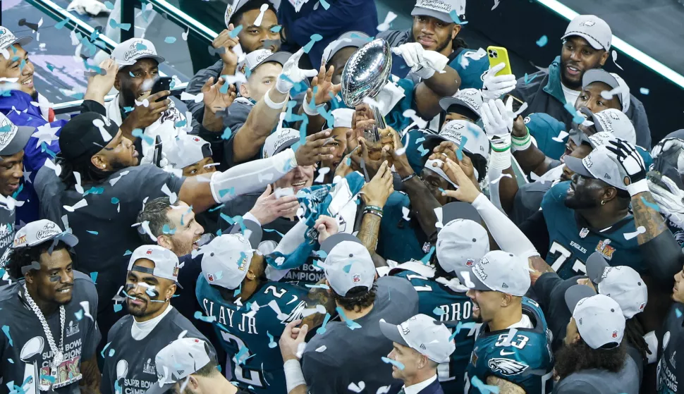 epaselect epa11885550 Philadelphia Eagles team members hold the Vince Lombardi Trophy as they celebrate defeating the Kansas City Chiefs during Super Bowl LIX at Caesars Superdome in New Orleans, Louisiana, USA, 09 February 2025. The Super Bowl is the annual championship game of the NFL between the AFC Champion and the NFC Champion and has been held every year since 1967. EPA/CJ GUNTHER
