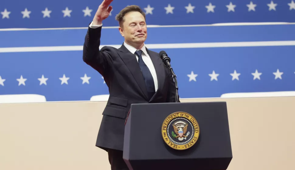 epa11840271 Tesla CEO Elon Musk gestures to the crowds at the Capitol One Arena after his address during inauguration ceremonies for US President Donald Trump in Washington, DC, USA, 20 January 2025. Trump was sworn in for a second term as president of the United States on 20 January. The presidential inauguration was held indoors due to extreme cold temperatures in DC. EPA/ALLISON DINNER