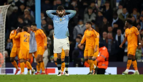 epa11889371 Josko Gvardiol of Manchester City reacts as Real Madrid players celebrate their third goal during the UEFA Champions League knockout phase play-offs 1st leg match between Manchester City and Real Madrid, in Manchester, Britain, 11 February 2025. EPA/ADAM VAUGHAN
