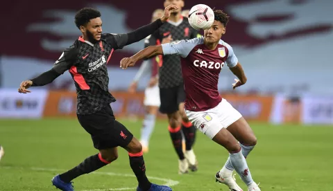 epa08721107 Joe Gomez of Liverpool FC (L) and Ollie Warkins of Aston Villa (R) in action during the English Premier League match between Aston Villa and Liverpool in Birmingham, Britain, 04 October 2020. EPA/Peter Powell/Pool EDITORIAL USE ONLY. No use with unauthorized audio, video, data, fixture lists, club/league logos or 'live' services. Online in-match use limited to 120 images, no video emulation. No use in betting, games or single club/league/player publications.