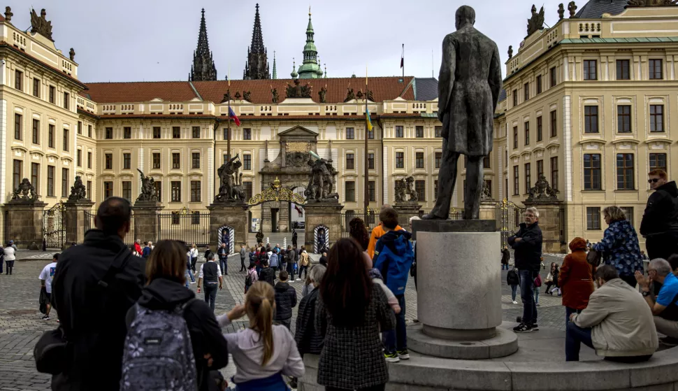 epa10224484 People stand in front of closed Prague Castle in Prague, Czech Republic, 05 October 2022. Prague Castle will host Leaders meeting within the European Political Community on 06 October and an Informal EU Summit on 07 October. EPA/MARTIN DIVISEK