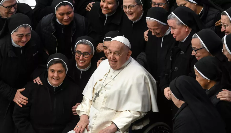 epa11876055 Pope Francis poses with nuns during his weekly general audience at the Paul VI Hall, in Vatican City, 05 February 2025. EPA/ALESSANDRO DI MEO