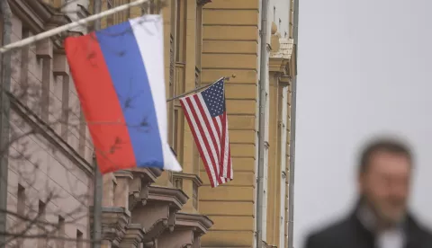 epa11958141 A man walks near Russian (front) and US flags hanging on the main building of the US Embassy in Moscow, Russia, 12 March 2025. The Kremlin expects the US to inform Russia about the results of the US-Ukrainian talks in Jeddah, and does not rule out a telephone conversation between Presidents Vladimir Putin and Donald Trump, said Dmitry Peskov, the press secretary of the head of the Russian state. As a result of the talks between the American and Ukrainian sides in Saudi Arabia, Kyiv agreed to a 30-day truce in the conflict in Ukraine. EPA/SERGEI ILNITSKY